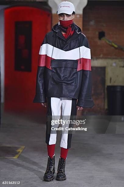 Model walks the runway at the Agi & Sam Autumn Winter 2017 fashion show during London Menswear Fashion Week on January 7, 2017 in London, United...