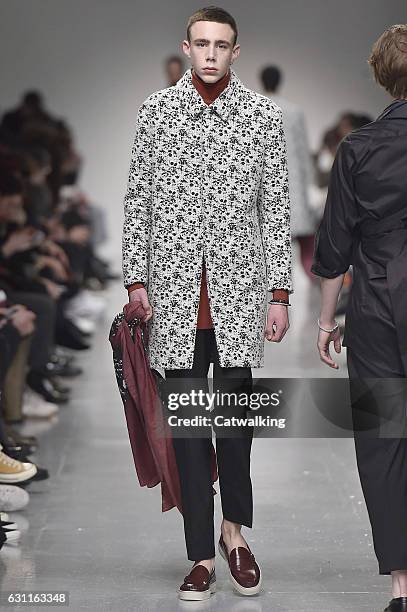 Model walks the runway at the Matthew Miller Autumn Winter 2017 fashion show during London Menswear Fashion Week on January 7, 2017 in London, United...