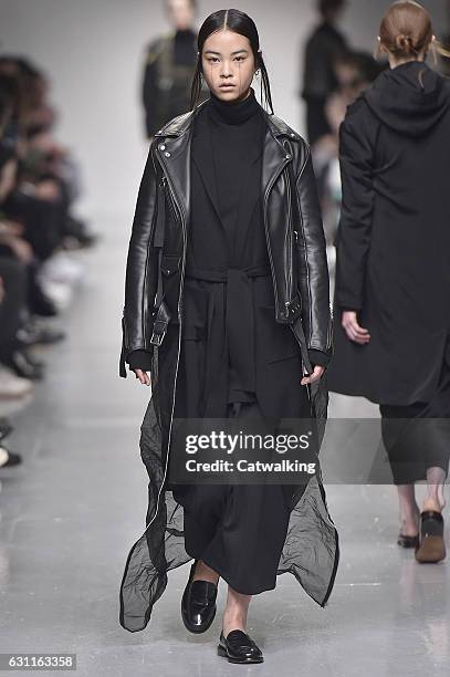 Model walks the runway at the Matthew Miller Autumn Winter 2017 fashion show during London Menswear Fashion Week on January 7, 2017 in London, United...