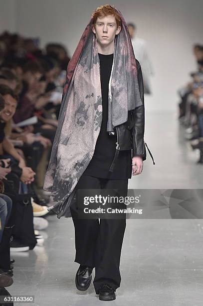 Model walks the runway at the Matthew Miller Autumn Winter 2017 fashion show during London Menswear Fashion Week on January 7, 2017 in London, United...