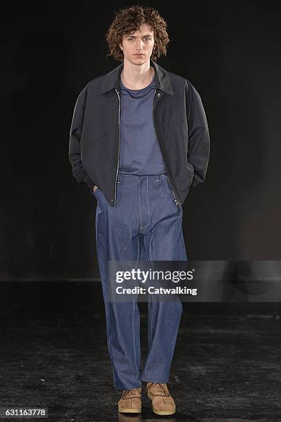 Model walks the runway at the E. Tautz Autumn Winter 2017 fashion show during London Menswear Fashion Week on January 7, 2017 in London, United...