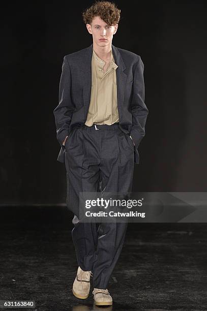 Model walks the runway at the E. Tautz Autumn Winter 2017 fashion show during London Menswear Fashion Week on January 7, 2017 in London, United...