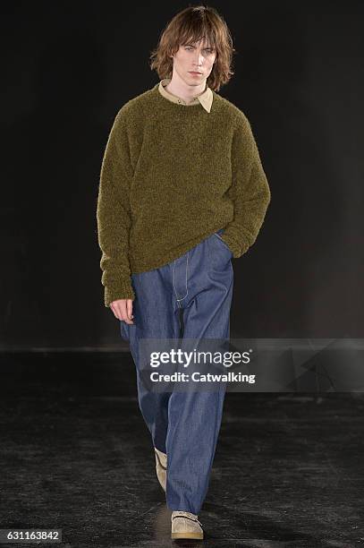 Model walks the runway at the E. Tautz Autumn Winter 2017 fashion show during London Menswear Fashion Week on January 7, 2017 in London, United...