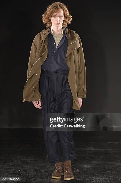 Model walks the runway at the E. Tautz Autumn Winter 2017 fashion show during London Menswear Fashion Week on January 7, 2017 in London, United...