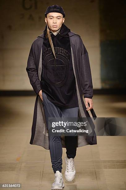 Model walks the runway at the Astrid Andersen Autumn Winter 2017 fashion show during London Menswear Fashion Week on January 7, 2017 in London,...