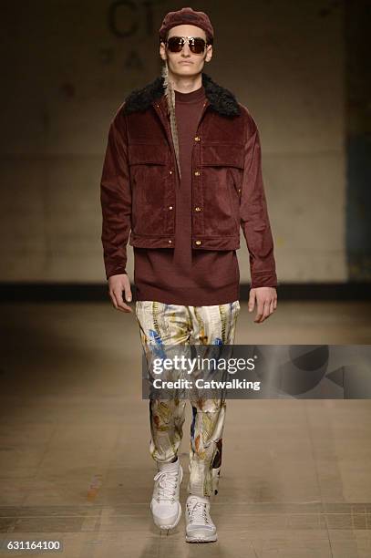 Model walks the runway at the Astrid Andersen Autumn Winter 2017 fashion show during London Menswear Fashion Week on January 7, 2017 in London,...