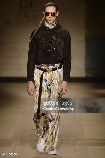 Model walks the runway at the Astrid Andersen Autumn Winter 2017 fashion show during London Menswear Fashion Week on January 7, 2017 in London,...