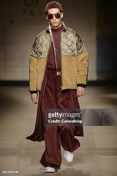 Model walks the runway at the Astrid Andersen Autumn Winter 2017 fashion show during London Menswear Fashion Week on January 7, 2017 in London,...