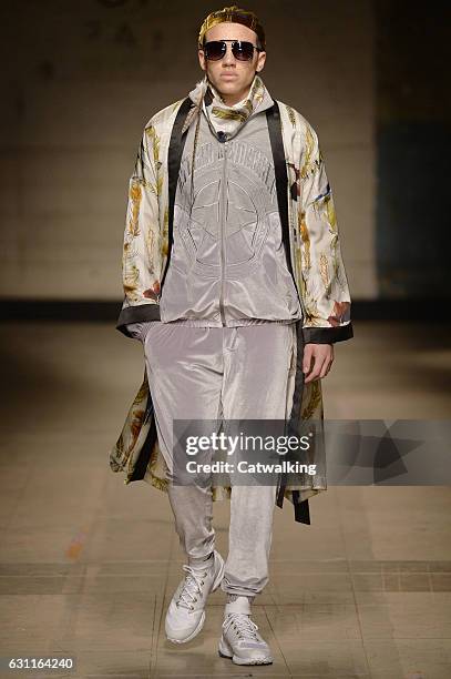 Model walks the runway at the Astrid Andersen Autumn Winter 2017 fashion show during London Menswear Fashion Week on January 7, 2017 in London,...