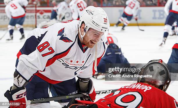 Liam O'Brien of the Washington Capitals smiles as he talks with Matt OConnor of the Ottawa Senators during warmup prior to a game at Canadian Tire...