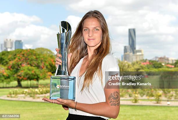 Karolina Pliskova of the Czech Republic poses for a photo with the winners trophy after winning the Women's Final, during day eight of the Brisbane...
