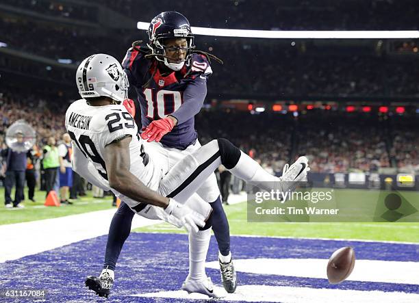 David Amerson of the Oakland Raiders interferes with a pass to DeAndre Hopkins of the Houston Texans in the end zone during the fourth quarter of...