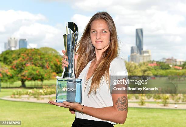 Karolina Pliskova of the Czech Republic poses for a photo with the winners trophy after winning the Women's Final, during day eight of the Brisbane...