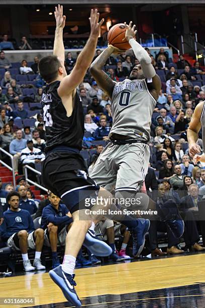 Georgetown Hoyas guard L.J. Peak is fouled in the second half by Butler Bulldogs forward Andrew Chrabascz on January 7 at the Verizon Center in...