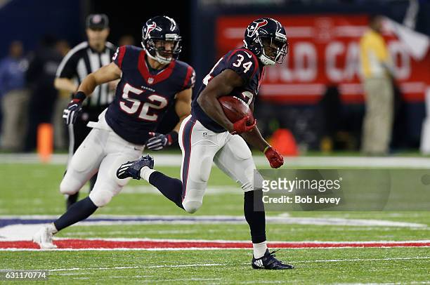 Tyler Ervin of the Houston Texans returns a punt against the Oakland Raiders in their AFC Wild Card game at NRG Stadium on January 7, 2017 in...