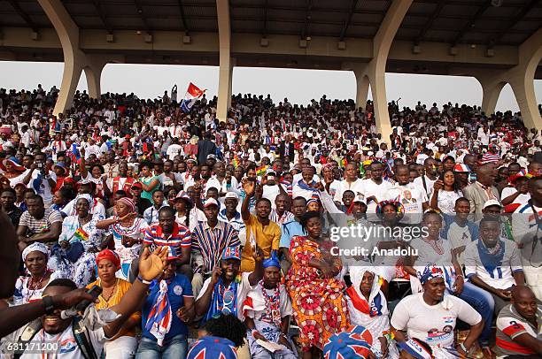 Supporters of New Patriotic Party leader and Newly-elected President of Ghana, Nana Akufo-Addo are seen during the swearing-in ceremony after the...