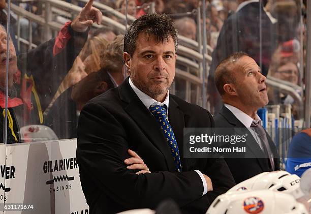 Head coach Jack Capuano of the New York Islanders looks on from the bench during the first period against the Arizona Coyotes at Gila River Arena on...