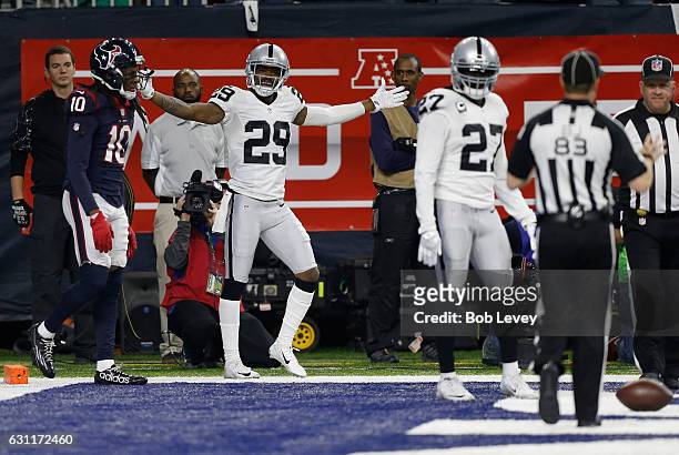David Amerson of the Oakland Raiders reacts after a pass interference call in the end zone against the Houston Texans in their AFC Wild Card game at...