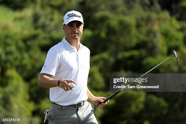 Justin Thomas of the United States reacts on the 17th green during the third round of the SBS Tournament of Champions at the Plantation Course at...