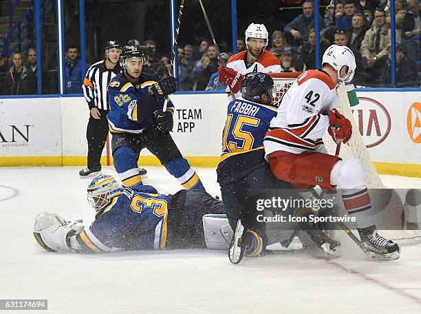St. Louis Blues goalie Jake Allen seals the crease and prevents a shot by Carolina Hurricanes' leftwing Joakim Nordstrom during a NHL game between...