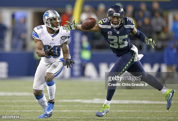 Defensive back DeShawn Shead of the Seattle Seahawks breaks up a pass intended for Wide receiver Anquan Boldin of the Detroit Lions in the NFC Wild...