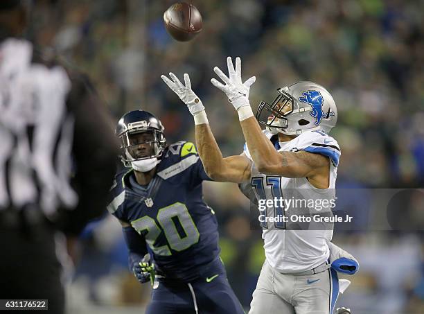 Wide receiver Marvin Jones of the Detroit Lions brings in a catch against the Seattle Seahawks in the NFC Wild Card game at CenturyLink Field on...