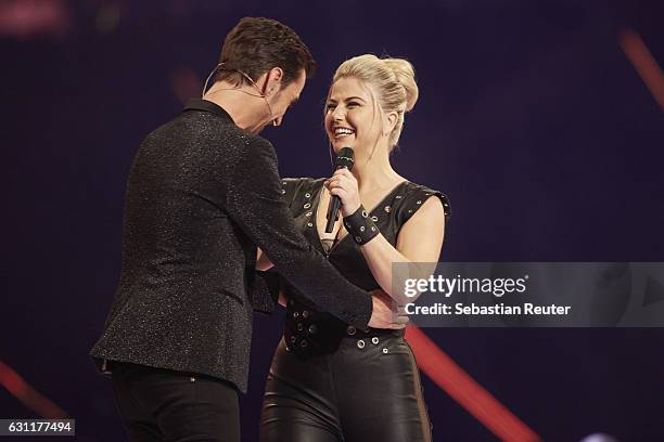 Florian Silbereisen and Beatrice Egli are seen on stage at the 'Das grosse Fest der Besten' tv show at Velodrom on January 7, 2017 in Berlin, Germany.