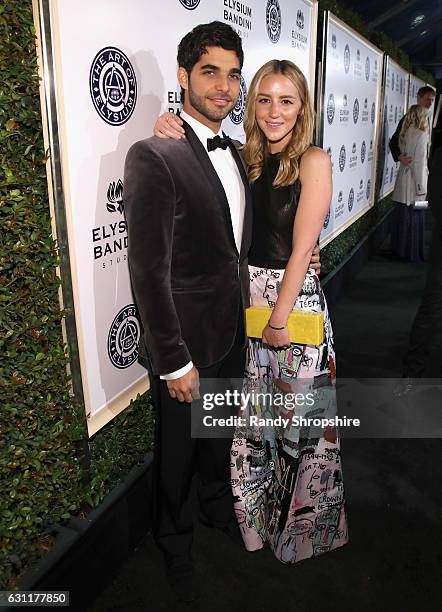 Songwriter Freddy Wexler and Olivia Zaro attend The Art of Elysium presents Stevie Wonder's HEAVEN - Celebrating the 10th Anniversary at Red Studios...