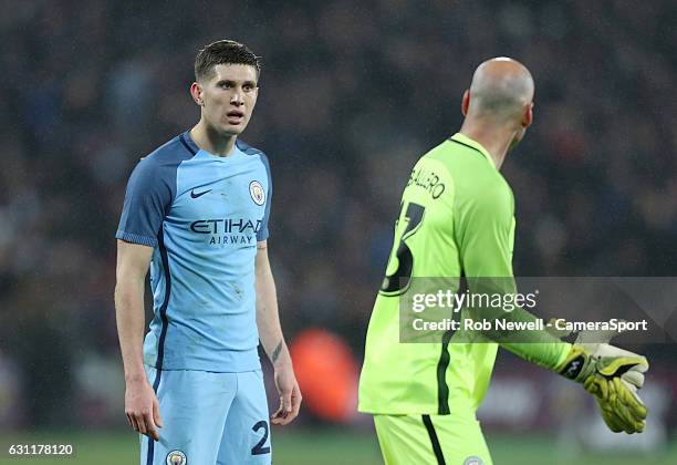 Manchester City's John Stones in discussion with team mate Wilfredo Caballero during the Emirates FA Cup Third Round match between West Ham United...