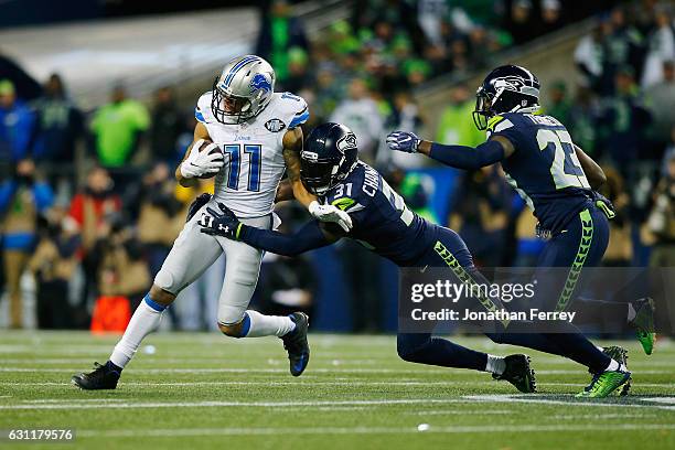 Kam Chancellor of the Seattle Seahawks attempts to tackle Marvin Jones of the Detroit Lions during the second half of the NFC Wild Card game at...