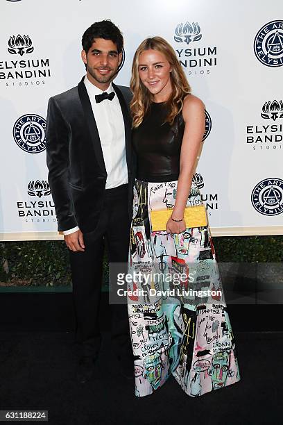 Songwriter Freddy Wexler and Olivia Zaro arrive at The Art of Elysium presents Stevie Wonder's HEAVEN celebrating the 10th Anniversary at Red Studios...