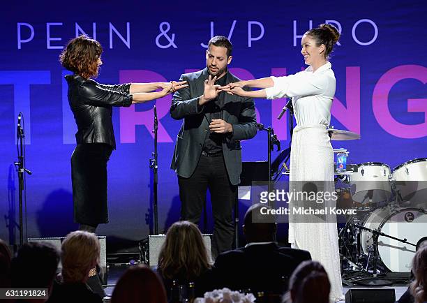 Magician David Blaine and actress/model Melissa Bolona perform onstage during the 6th Annual Sean Penn & Friends HAITI RISING Gala Benefiting J/P...