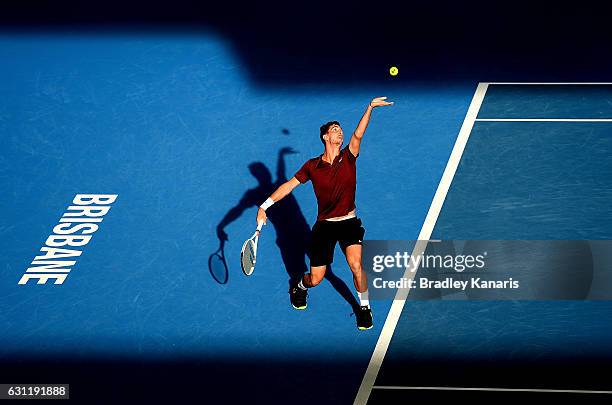 Thanasi Kokkinakis of Australia serves in his match with team mate Jordan Thompson of Australia against Gilles Muller of Luxembourg and Sam Querrey...