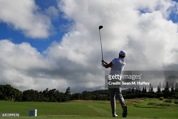Justin Thomas of the United States plays his shot from the 14th tee during the third round of the SBS Tournament of Champions at the Plantation...