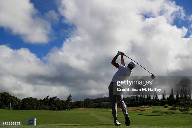 Justin Thomas of the United States plays his shot from the 14th tee during the third round of the SBS Tournament of Champions at the Plantation...