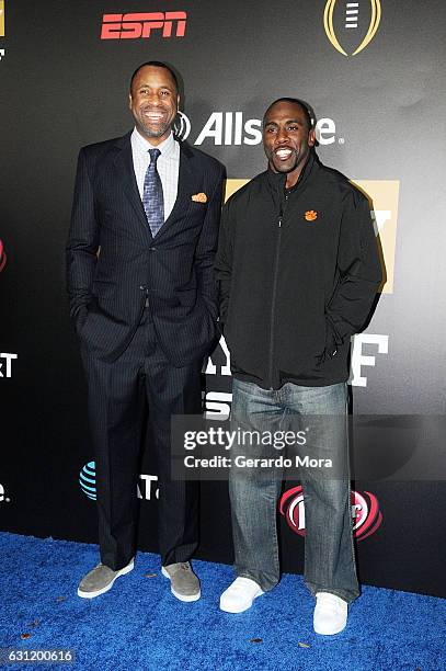 Former basketball player Greg Buckner and football player C.J. Spiller pose on the blue carpet during the Allstate Party At The Playoff on January 7,...