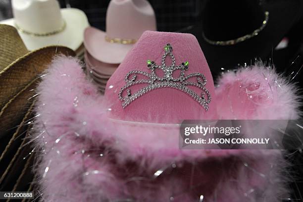 Fuzzy fur and sequin cowboys hats, one of many variations of traditional cowboy hats, are seen on sale at the National Western Stock Show in Denver,...