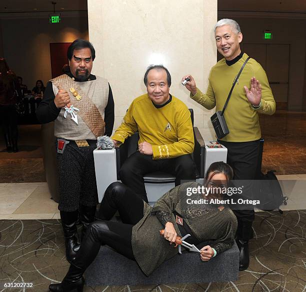 Star Trek cosplayers Bill Arucan, David Cheng, Mark Lum and Michelle Wells pose with the Captain's Chair provided by The Hollywood Sci-Fi Museum at...