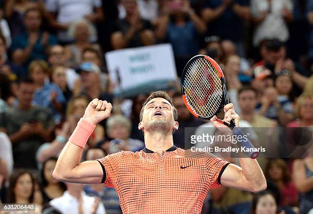Grigor Dimitrov of Bulgaria celebrates victory against Kei Nishikori of Japan after the Men's Final on day eight of the 2017 Brisbane International...