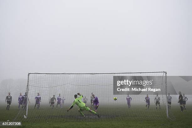 View of the action in the fog during a park football match ahead of the Emirates FA Cup Third Round match between Preston North End and Arsenal at...