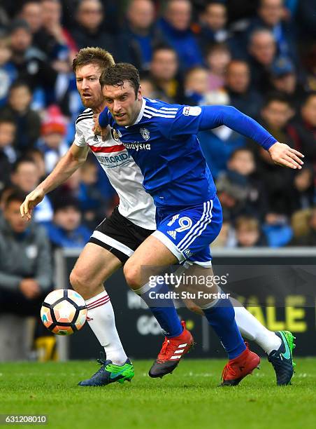 Rickie Lambert of Cardiff City and Tim Ream of Fulham in action during The Emirates FA Cup Third Round match between Cardiff City and Fulham at...