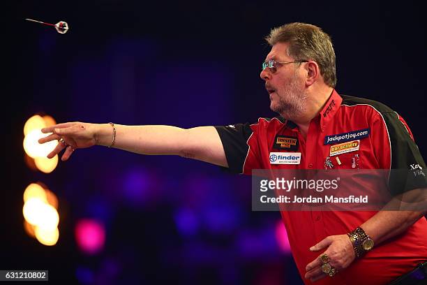 Martin Adams of England throws during his Men's First Round match against Ryan Joyce of England on Day Two of the BDO Lakeside World Professional...