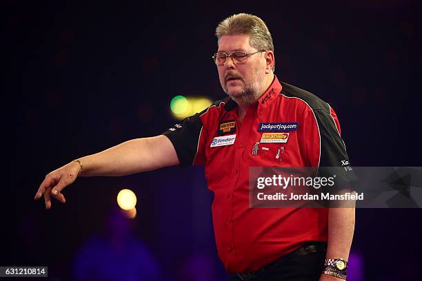 Martin Adams of England looks dejected during his Men's First Round match against Ryan Joyce of England on Day Two of the BDO Lakeside World...