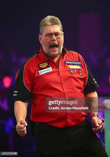 Martin Adams of England celebrates victory in his Men's First Round match against Ryan Joyce of England on Day Two of the BDO Lakeside World...