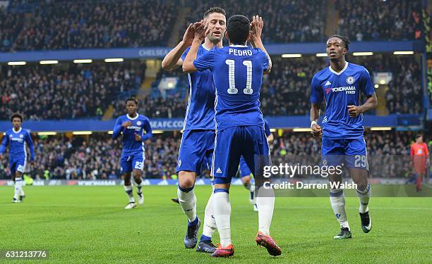 Pedro of Chelsea celebrates scoring his sides first goal with Gary Cahill of Chelsea during The Emirates FA Cup Third Round match between Chelsea and...