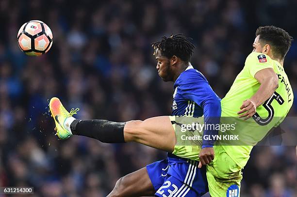 Chelsea's Belgian striker Michy Batshuayi battles with Peterborough United's English defender Ryan Tafazolli during the English FA Cup third round...