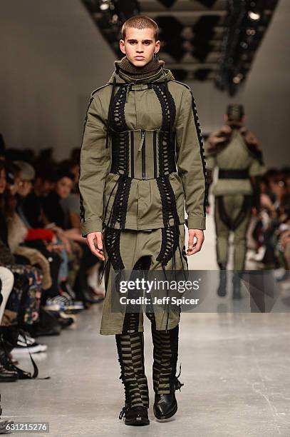 Model walks the runway at KTZ show during London Fashion Week Men's January 2017 collections at BFC Show Space on January 8, 2017 in London, England.