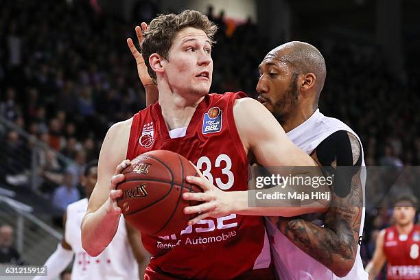 Patrick Heckmann of Brose Bamberg is challenged by Kenneth Horton of Telekom Baskets Bonn during the BBL Bundesliga match between Telekom Baskets...