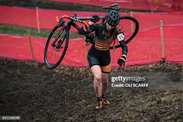 Rider Joanne Clay carries her bike on a steep uphill section of the Elite Women's Championship on the second day of the 2017 British Cycling National...