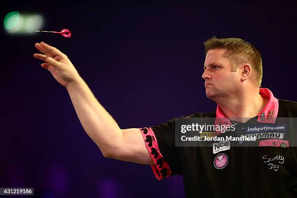 Scott Mitchell of England throws during his First Round match against Mark McGrath of New Zealand on Day Two of the BDO Lakeside World Professional...